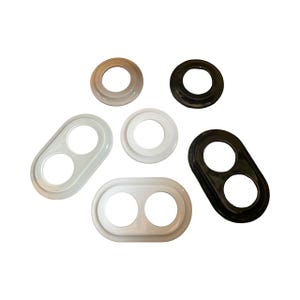 May include: An assortment of six plastic parts in various shapes and colors. There are two oval-shaped pieces with two holes, two circular pieces, and two other pieces with a single hole. Colors include white, black, and beige.