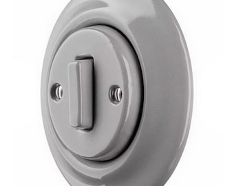 Chinchilla Grey Glass Light Switch With Metal Frame. Modern