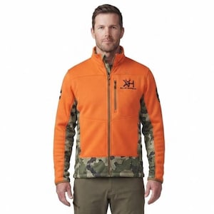 May include: A full-zip jacket featuring a bright orange front and back panel with a camouflage pattern on the sides and sleeves. The jacket has a stand-up collar, a vertical zippered chest pocket, and a black logo with the text Vortex Optics.