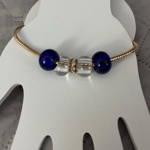 Beaded charm bracelet with snake chain