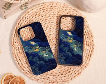 May include: Two rectangular phone cases featuring a dark blue night landscape illustration with dense forest foliage, small yellow glowing lights, and a crescent moon. The cases have a black border and a square cutout for the camera lens.