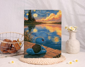 May include: A rectangular notebook featuring a vibrant, impressionistic-style illustration of a blue turtle-like creature sitting on a wooden dock overlooking a lake at sunset, with swirling clouds and a dark cypress tree in the background.