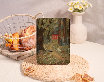 May include: An art print shows a forest scene with a red cabin on a path. The artwork features a path leading to a cabin, surrounded by trees and flowers. A skunk walks on the path. The print is displayed on a woven placemat.