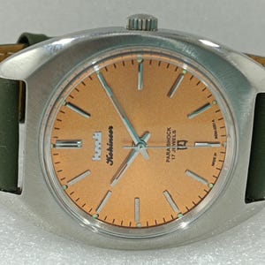 HMT Kohinoor Orange Dial Hand-Winding Watch: 17 Jewels, Para Shock