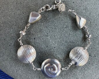 Silver Bracelet with Swirls, Discs and Nuggets