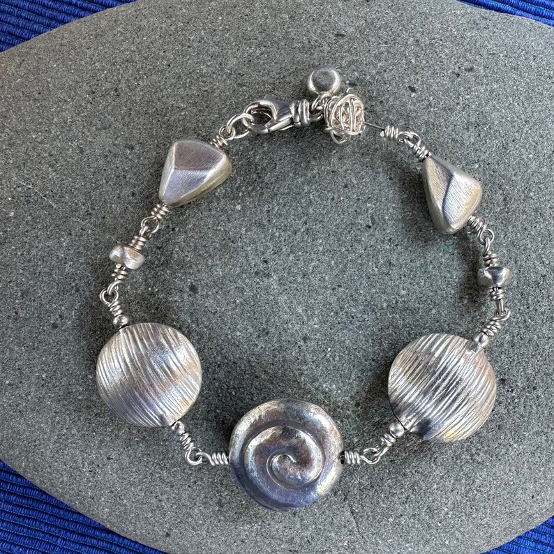 Silver Bracelet with Swirls, Discs and Nuggets image 1