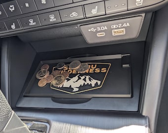 Cubierta y bandeja para cargador inalámbrico del Subaru Outback 2026