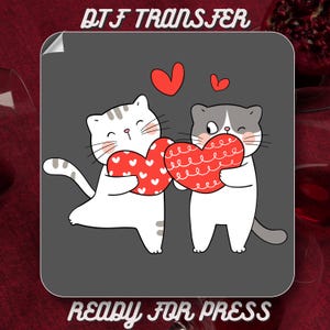 May include: DTF TRANSFER graphic featuring two cartoon cats holding red heart-shaped objects. The cats are white and gray, with hearts above them. The text "READY FOR PRESS" is at the bottom.