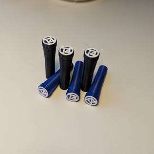 May include: Six blue and black plastic door knob covers with a white circle and the number 14 printed on them.