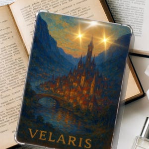 May include: A phone case displaying a detailed painting of a fantasy city with a bridge, river, and mountains under a starry sky. The word "VELARIS" is printed in gold at the bottom. The case is on top of an open book.
