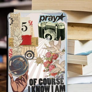 May include: A decorative phone case with a collage design. It features a vintage camera, doves, roses, and the text "pray". The case also includes the text "OF COURSE I KNOW I AM DRAMATIC".