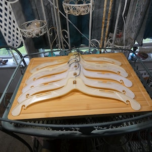 Six Vintage Plastic Clothing or Coat Hangers