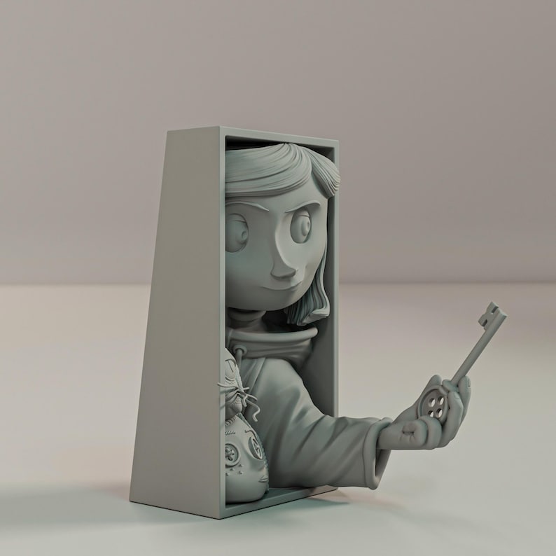 May include: A grey figurine of a girl holding a key and a button. The girl's head and arm extend from a grey rectangular box. A doll-like face is visible in the box. The key is held in the girl's hand.
