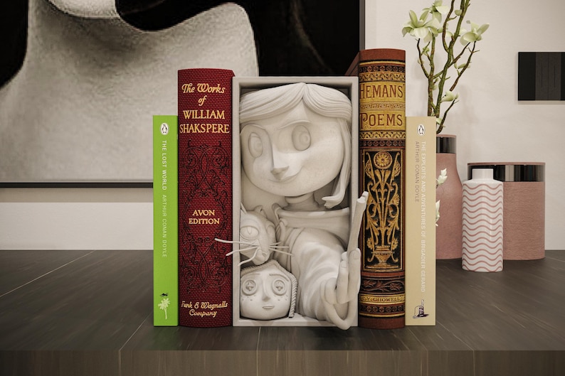 May include: A decorative bookshelf featuring a white sculpture of a character with a cat, flanked by vintage books. The books include titles like "The Works of William Shakspere" and "Hemans Poems". The color palette includes red, green, and gold.