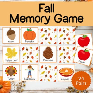 May include: A fall-themed memory game with illustrated cards featuring acorns, pumpkins, leaves, pinecones, apples, a turkey, a scarecrow, and pumpkin pie. The game includes 24 pairs of cards, perfect for autumn activities.