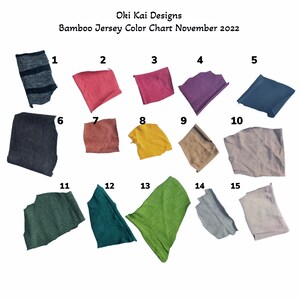 May include: Color chart of 15 fabric swatches, numbered 1 through 15, showing different shades of green, blue, gray, brown, red, and yellow bamboo jersey fabric.