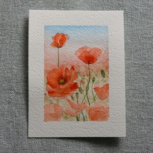 Papaveri dipinti a mano in acquarello su cartoncino per biglietto o cornice. Hand-painted poppies in watercolour on card or frame.