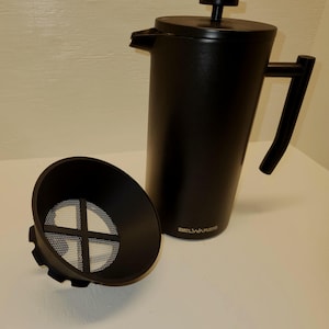 May include: A black French press coffee maker with a handle and lid, and a separate filter. The brand name "BELWARES" is printed on the side. The coffee maker is cylindrical and made of a matte black material.