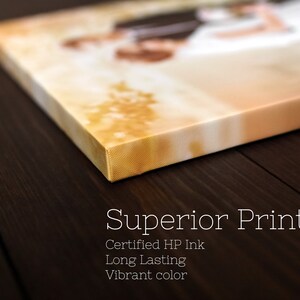 May include: Close-up of a canvas print with a wedding photo, showcasing a corner and side view. The text "Superior Printing" is displayed, along with details about the ink and color.