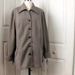 May include: A brown and white checked blazer with a button-up front and long sleeves. The blazer has a collar and a pocket on each side.