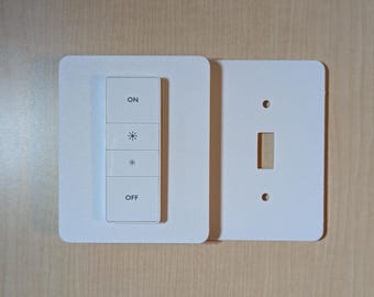 Montaje del interruptor regulador Philips Hue (versión antigua): Placa de cubierta parcial para interruptor de luz con dos interruptores de palanca.