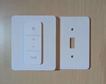 Montaje del interruptor regulador Philips Hue (nueva versión): Placa de cubierta parcial para interruptor de luz con dos interruptores de palanca.