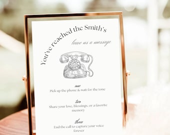 May include: A framed sign with the text "You've reached the Smith's, leave us a message." The sign includes a drawing of a rotary phone and instructions for leaving a message. The frame is gold.