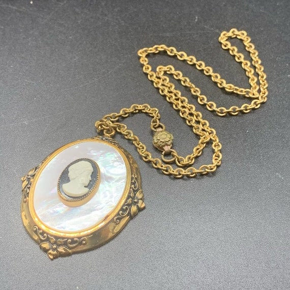 Mother of pearl faux cameo pendant necklace with gold… Gem