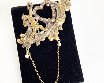 angel brooch angel with heart and chain dangle gold angel pin stamping style vintage costume jewelry