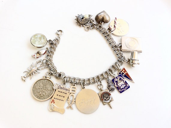 vintage Sterling silver charm bracelet loaded wit