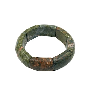 May include: A green, brown, and pink stone bracelet made of multiple round beads. The bracelet is made of natural stone and has a polished finish.