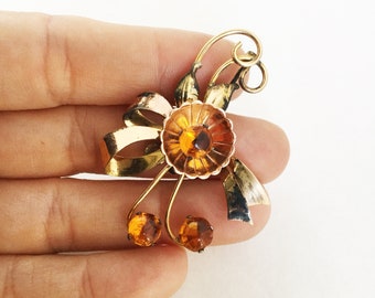 HI Harry Iskin early vintage  Gold Filled  flower brooch  with bow ribbon scroll topaz glass stones