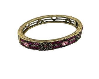 HEIDI DAUS  Hinged Bangle Bracelet With Pink Crystals Antiqued Gold Color