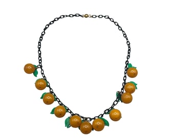 Vintage 1930s Art Deco Orange Bakelite Fruit Necklace With Green Leaves
