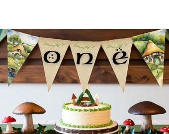 Striscione stampabile per il primo compleanno "One" ispirato al mondo fantasy, con casetta nel bosco incantata.