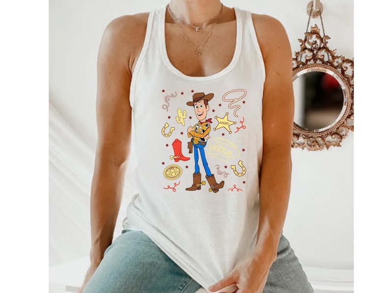 A person wearing a white tank top with a cartoon character from the Toy Story franchise.