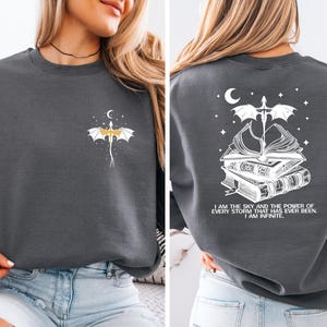 The image is a collage of two photos of a woman wearing a gray sweatshirt with a dragon design and a quote on the back.