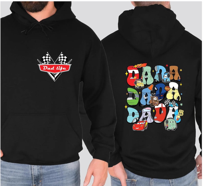May include: Black hoodie with a red and white checkered flag design and the text "Dad Life" on the front. The back of the hoodie features a colorful graphic of cartoon cars spelling out "DADA" with stars.