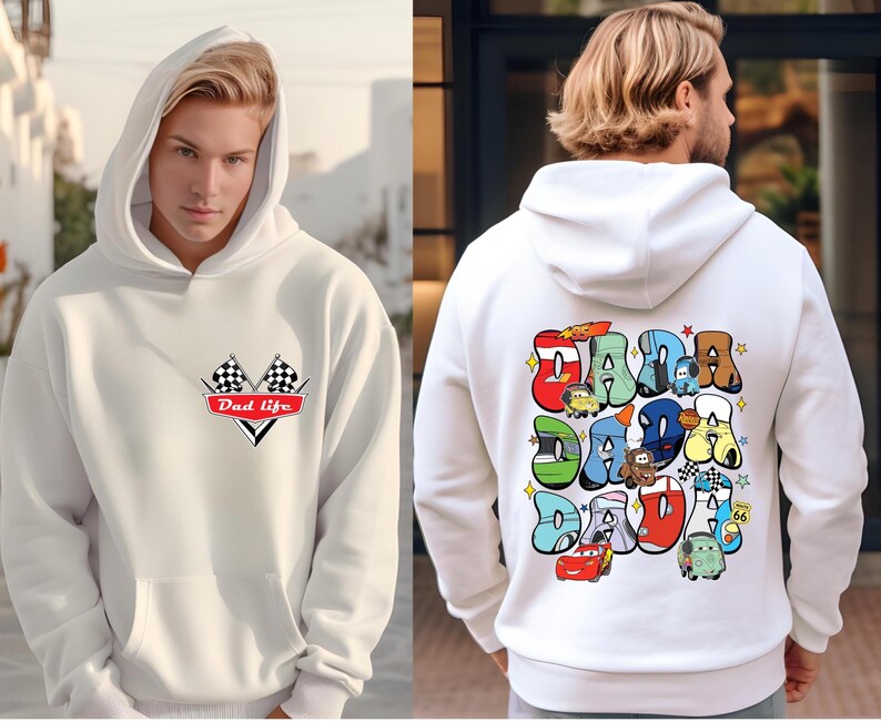 May include: White hooded sweatshirt with a red and black checkered flag design and the text "Dad Life" on the front. The back of the sweatshirt features a colorful graphic of the word "Dada" with cartoon cars and characters.
