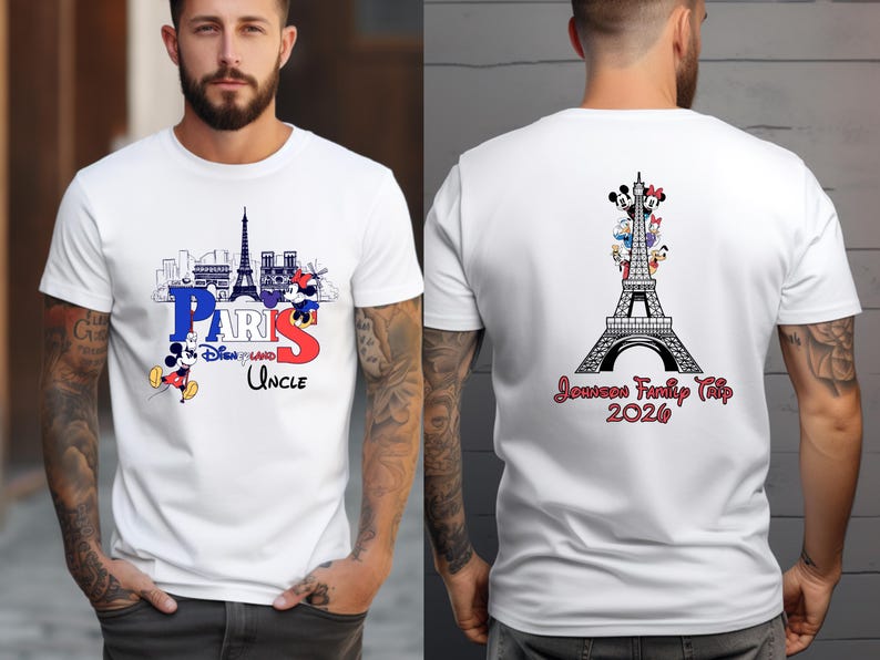 A man wearing a white t-shirt with a graphic design featuring the Eiffel Tower and Mickey Mouse.