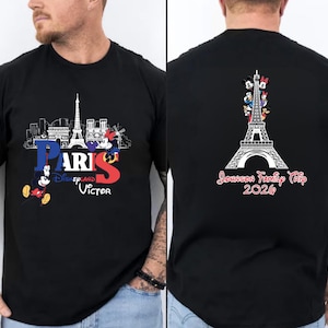 The image is a collage of two photos. The left photo shows a man wearing a black t-shirt with a graphic design featuring the Eiffel Tower and Mickey Mouse, along with the text "Paris Disney Victor". The right photo shows the back of the same man's black t-shirt, with the text "Journey to Paris Disney Victor 2026" printed on it.