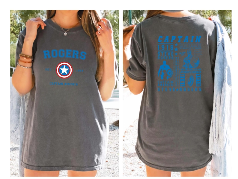 Puede incluir: Una camiseta gris con un logotipo azul y rojo de Capit&aacute;n Am&eacute;rica en la parte delantera y texto que dice "ROGERS" sobre el logotipo. La parte posterior de la camiseta tiene texto azul que dice "CAPTAIN" y "1918" con una estrella y "SUPER SOLDIER" con una estrella. El texto tambi&eacute;n dice "AVENGERS ASSEMBLE" y "ENDGAME" con una estrella.