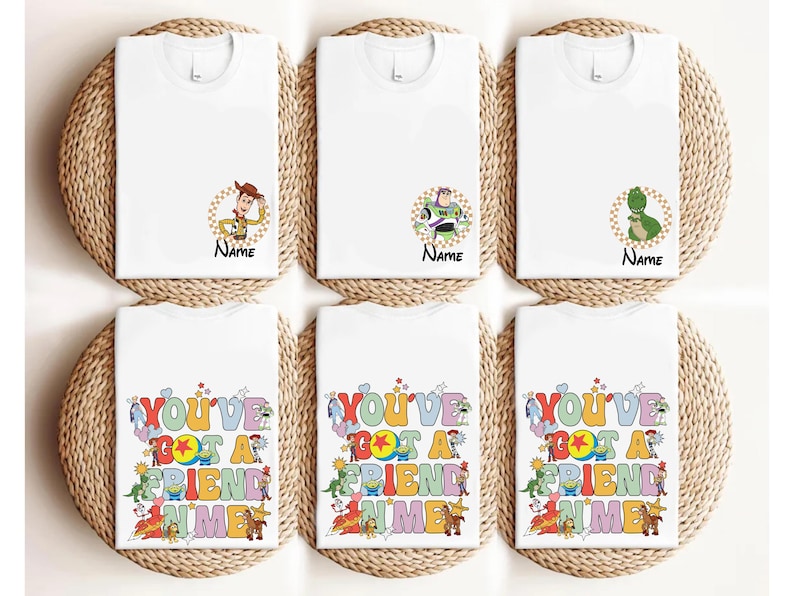 six white t-shirts with various cartoon character designs and text printed on them.