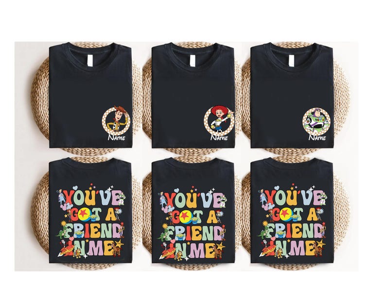 a collection of six black t-shirts with colorful text and characters, arranged in a grid-like pattern.