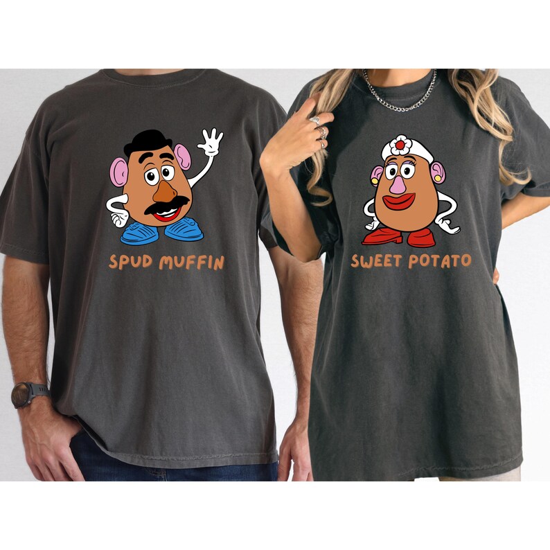 two people wearing t-shirts with cartoon characters on them.