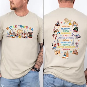 A man wearing a t-shirt with a colorful graphic design depicting various landmarks and icons from different countries around the world, including Mexico, Norway, China, Germany, Italy, the United States, Japan, Morocco, France, the United Kingdom, and Canada.