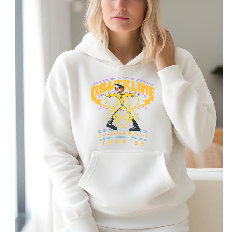 May include: White hoodie with a yellow and black graphic of a cartoon character holding two lightning bolts. The graphic says "Powerline S.O.U.T. Tour '95".