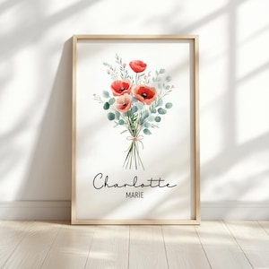 Puede incluir: Una impresi&oacute;n enmarcada en acuarela con un ramo de amapolas rojas y hojas de eucalipto atadas con hilo. La impresi&oacute;n incluye el nombre "Charlotte" y la palabra "MARIE" en cursiva. El marco es de color madera clara.