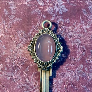 May include: A set of three ceramic mugs with a speckled, matte finish in cream, light grey, and dark grey. Each mug has a simple, minimalist design, ideal for coffee or tea.