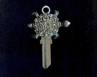 crystal back turtle house key blank....Only Available in Schlage blank